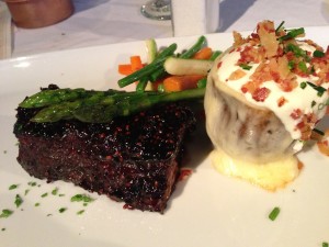 Center Cut Short Ribs served with a raspberry-chipotle glaze, and the baked potato